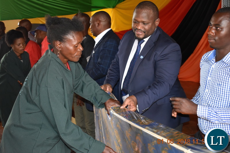 Minister of National Development Planning Alexander Chiteme handing over awards to various recipients on behalf of Government institutions and private sector companies during the Labour Day Celebrations in Mbala on 1 May 2018. – PHOTO | CHIBAULA D. SILWAMBA | MNDP