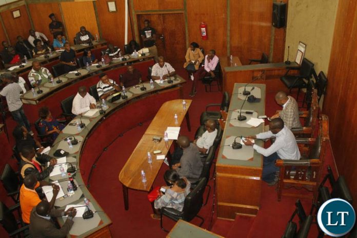 Christopher Kangombe and Local Government and Housing Minister Vincent Mwale addressing representatives of Chisokone Marketeers at City Council Chambers Christopher Kangombe and Local Government and Housing Minister Vincent Mwale addressing representatives of Chisokone Marketeers at City Council Chambers