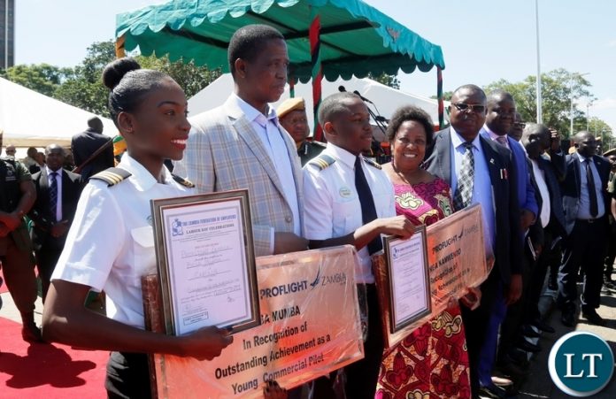 FROM LEFT TO RIGHT: Besa Mumba, President Edgar Chagwa Lungu, Kalengo Kamwenda and Labour Minister Joyce Nonde-Simukoko during the Labour Day Commemorations at Freedom Statue in Lusaka on Tuesday,May 1,2018. The young pilots were recipients of the Presidential Labour Awards. PICTURE BY SALIM HENRY/STATE HOUSE ©2018