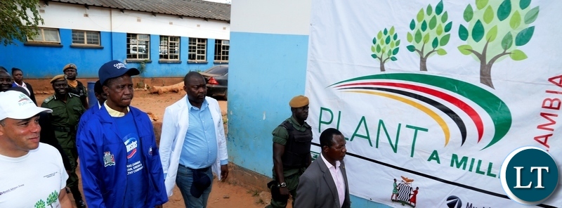 President Edgar Chagwa Lungu (left) listens to Forest Director Ignatius Makumba as he explains something to him at Chakunkula Basic School during the ''Zambia plant a Million Trees Initiative and Keep Zambia Clean, Green and Healthy'' event in Lusaka on Saturday, May 26, 2018. PICTURE BY SALIM HENRY/STATE HOUSE ©2018