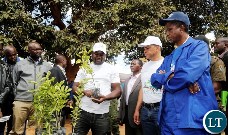 FROM LEFT TO RIGHT: Plant A Million Trees Chief Executive Officer Emmanuel Chibesakunda, President Edgar Chagwa Lungu and Lusaka Province Minister Bowman Lusambo at Chakunkula Basic School during the ''Zambia plant a Million Trees Initiative and Keep Zambia Clean ,Green and Healthy'' event in Lusaka on Saturday, May 26, 2018. PICTURE BY SALIM HENRY/STATE HOUSE ©2018