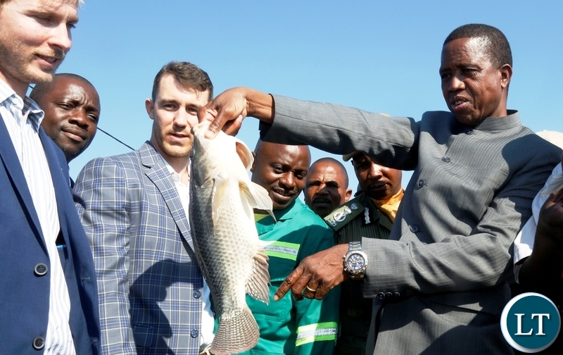 1. President Edgar Chagwa Lungu (right) at Yalelo hatchery holding a three-year old male broodstock after Commissioning the Ale Aqua Fish Feed Plant in Siavonga District, Southern Province on Wednesday,May 30,2018 PICTURE BY SALIM HENRY/STATE HOUSE ©2018