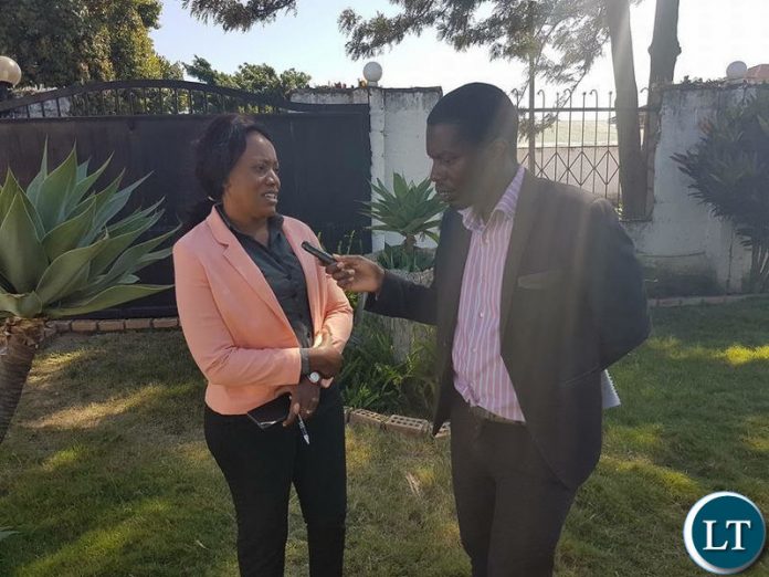 Action Aid Country Director Nalucha Ziba being interviewed during the news briefing.