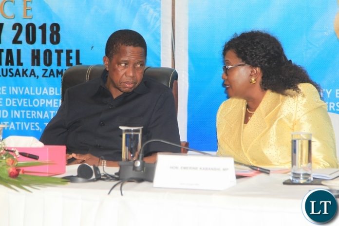 President Edgar Lungu confers with Community development Minister Emerine Kabanshi during the 6th community based rehabilitation (CBR)Africa conference held at Intercontinental Hotel