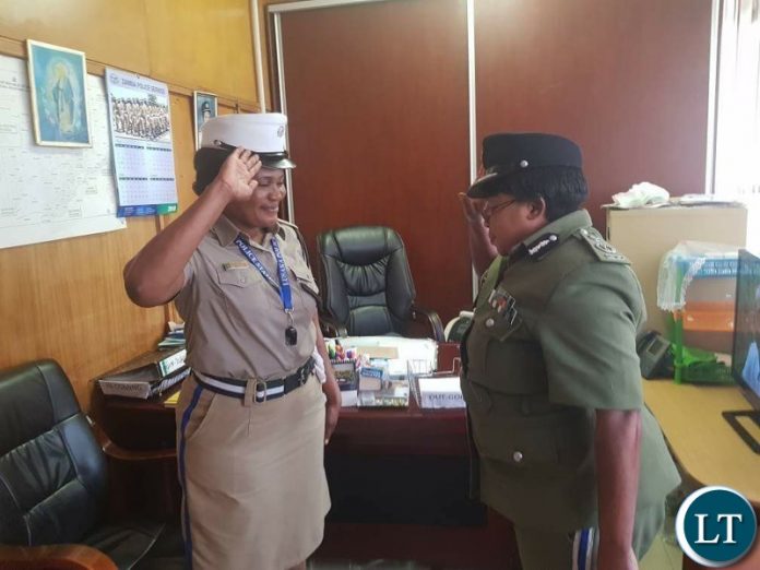 Charity Nanyangwe with Commissioner of Police in Charge of Administration Lombe Kamukoshi during the promotion ceremony
