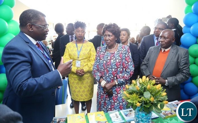 Director National Water Supply and Sanitation Council Kelvin Chitumbo stress a point to Vice President Inonge Wina during the tour of stands shortly after the official opening of Zambia Water Forum and Exhibition at Government Complex yesterday 11-06-2018. Picture by ROYD SIBAJENE/ZANIS