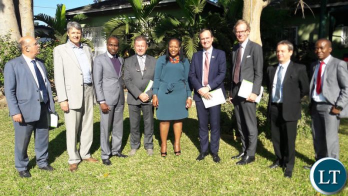 A group of EU Ambassadors meeting with FIC Director General Mary Tshuma ( in green) at the FIC Offices on Tuesday