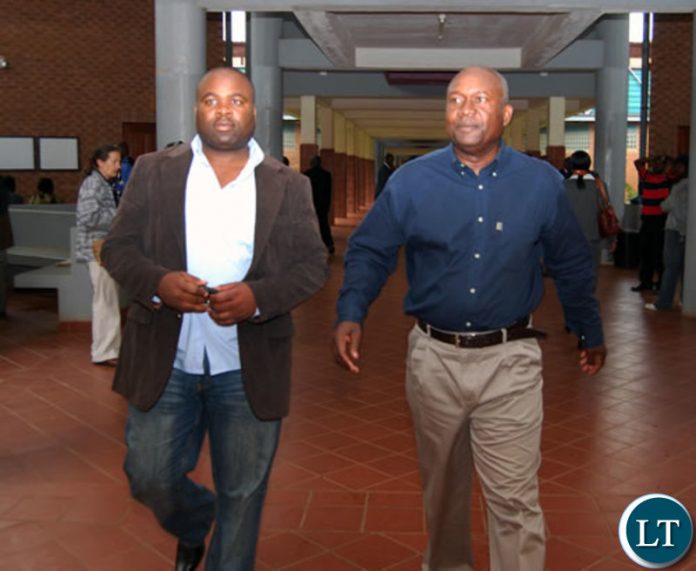 Former Spy Chief Xavier Chungu (L)