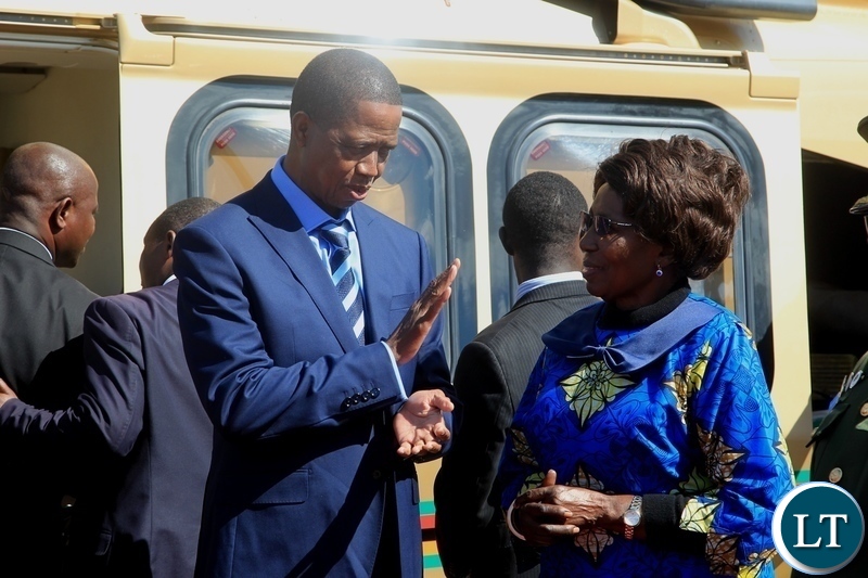 President Edgar Lungu confers with Vice President Inonge Wina before departure for Kenya for a private visit at Kenneth Kaunda International Airport