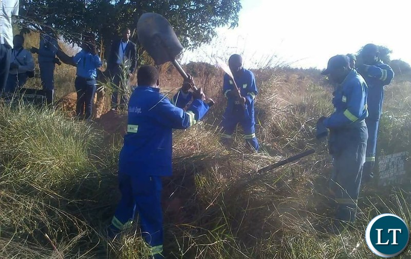 Council Workers exhuming the body of the girl who died and was buried at grave 73