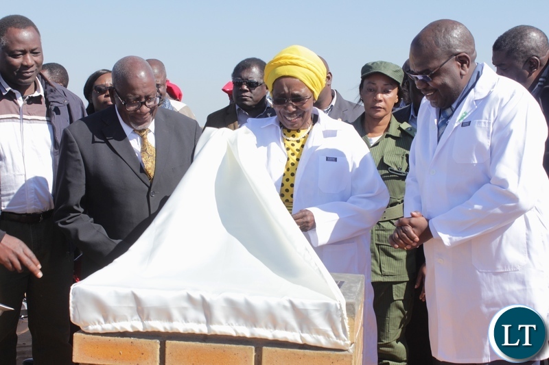 Vice President Inonge Wina (c) unveils the Foundation Lay Stone as Health Minister Chitalu Chilufya (r), Barotse Royal Establishment (BRE) Ngambela (Prime Minister) Mwenda Nyambe (l) and Western Province Minister Richard Kapita (far left) look on during the ground breaking ceremony for the proposed construction site of Lealui Mini Hospital in Mongu