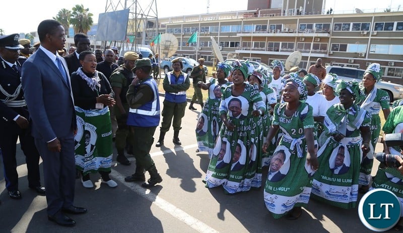 President Edgar Lungu being entertained with praising songs by PF chair shortly before his departure for South Africa at Kenneth Kaunda International Airport