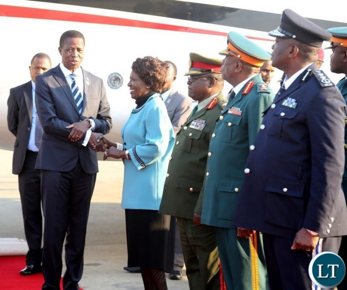 Vice President Inonge Wina welcomes President Edgar Lungu shortly after his arrival from South Africa at Kenneth Kaunda International Airport