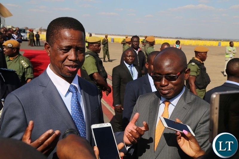 President Edgar Lungu flanked by Special Assistant to President for Press and Public Relation Amos Chanda speaking to Journalists shortly before his departure for South Africa at Kenneth Kaunda International Airport