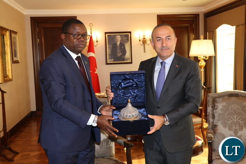 Minister of Foreign Affairs Joseph Malanji presents a gift to his Turkish counterpart Mevlut Cavusoglu at the Ministry of Foreign Affairs of the Republic of Turkey headquarters in Ankara