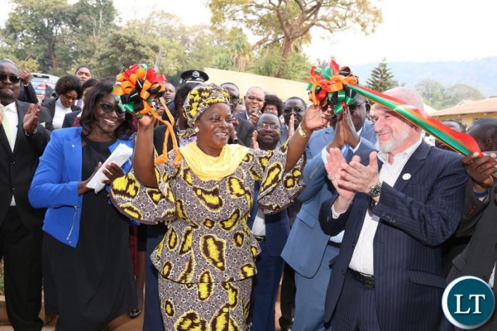 First Lady Esther Lungu cuts a ribbon with IIROSA Regional Director -Southern Africa Sheikh Walid R. EL Saadi and Health Minister Dr Chitalu Chilufya during the Commissioning of the eye hospital at Chipata Central Hospital, where she also launched an eye camp set by the Esther Lungu Foundation Trust in partnership with the International Islamic Relief Organization for Southern Africa (IIROSA) and the Ministry of Health on Tuesday, July 10,2018 -Picture by THOMAS NSAMA