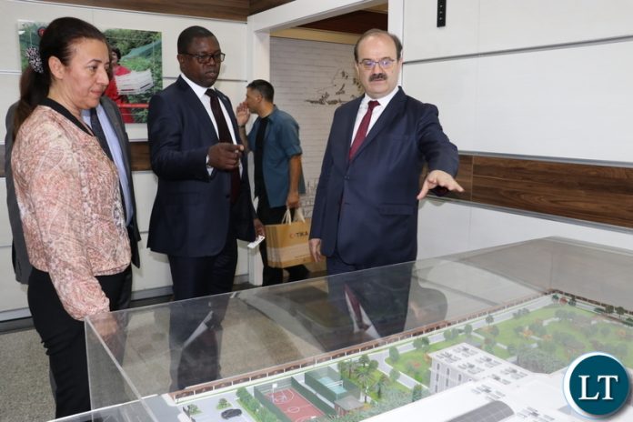 Turkish Cooperation and Coordination Agency (TIKA) President, Dr Serdar Cam shows a miniature building of a school project undertaken by TIKA to Minister of Foreign Affairs , Joseph Malanji in Ankara yesterday-Picture by JERRY MUNTHALI Turkish Cooperation and Coordination Agency (TIKA) President, Dr Serdar Cam shows a miniature building of a school project undertaken by TIKA to Minister of Foreign Affairs , Joseph Malanji in Ankara yesterday-Picture by JERRY MUNTHALI
