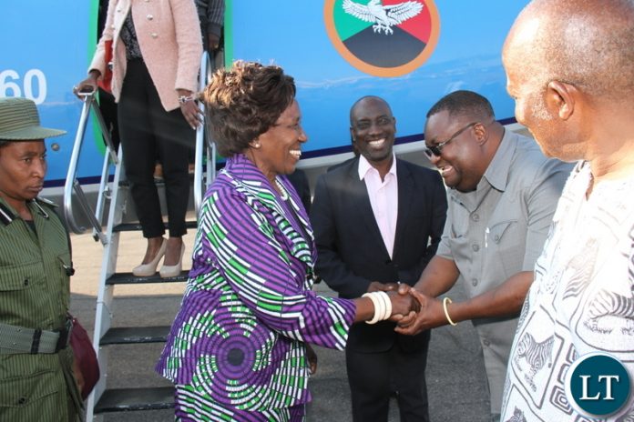Vice President Inonge Wina (l) greets Luapula Province Permanent Secretary Dr. Buleti Nsemukila (r) as Luapula Province Minister Nickson Chilangwa (M) looks on at Mansa Airport on Friday, July 13, 2018 - Picture By Godfrey Chikumbi/ZANIS Vice President Inonge Wina (l) greets Luapula Province Permanent Secretary Dr. Buleti Nsemukila (r) as Luapula Province Minister Nickson Chilangwa (M) looks on at Mansa Airport on Friday, July 13, 2018 - Picture By Godfrey Chikumbi/ZANIS