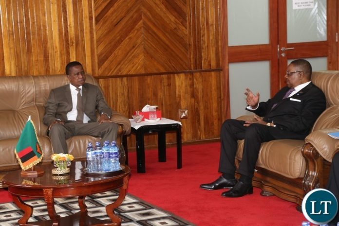 President Edgar Lungu confers with his Malawian counterpart Professor Peter Mutharika before the official opening the 20th Summit of the Comesa Heads of State and Government in Lusaka