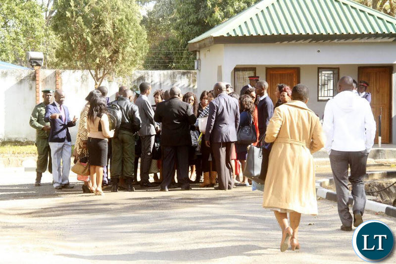 The civil servants take their walk of shame after they were told to leave the premises for coming late.
