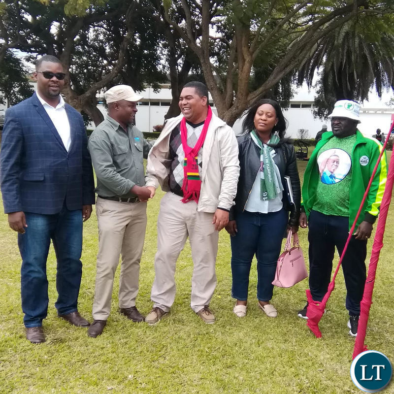 UPND and PF members shake hands during the joint UPND-PF press briefing.