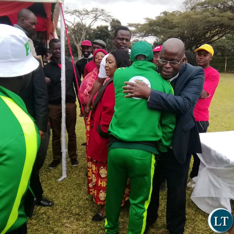 PF National Youth Chairman Stephen Kampyongo embraces UPND Spokesman Charles Kakoma delivering during the joint UPND-PF press briefing.