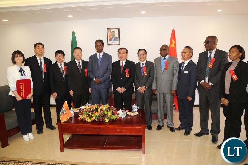 President Edgar Lungu pose for a group photograph with Sinoma members before the official opening of the China National Building Material Zambia Industry Plant in Chongwe District