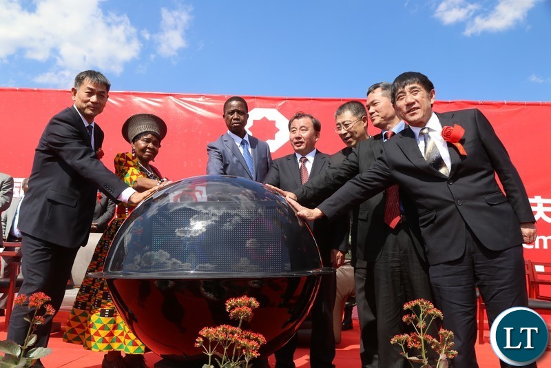 President Edgar Lungu with Chieftaniss Nkomeshya Mukamambo II starting off the crystal ball after the official opening of the China National Building Material Zambia Industry Plant in Chongwe District