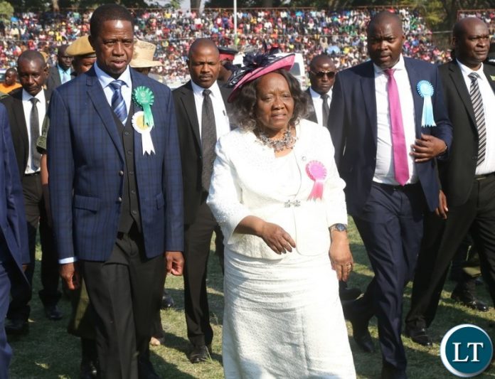 President Edgar Lungu, Show Society President Caroline Silwamba (c) Lusaka Province Minister Bowman Lusambo (r) arrives in the main arena at the show ground
