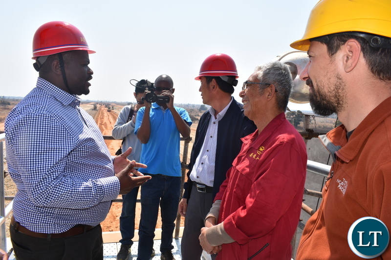Minister of National Development Planning Hon. Alexander Chiteme (left) talking to AFECC Contract Manager Jia Tao Kan, Jack Tao and resident engineer Alex Karampis at the Mwomboshi Dam in Chibombo District on Thursday 2 August 2018. Photo | Chibaula D. Silwamba | MNDP