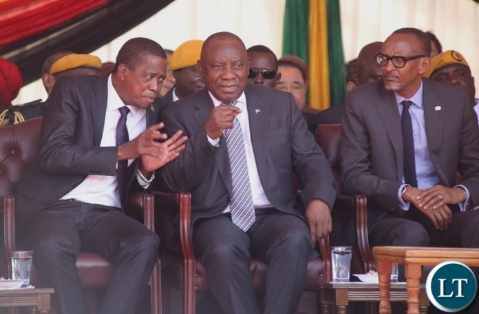 President Edgar Lungu confers with South African President Ramaposa whilst AU Chairperson who is also President of Rwanda Paul Kagami listens during President Emmerson Mnangagwa inauguration ceremony