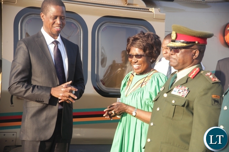 President Edgar Lungu talking to Vice President Inonge Wina before departure for Zimbabwe at Kenneth Kaunda International Airport