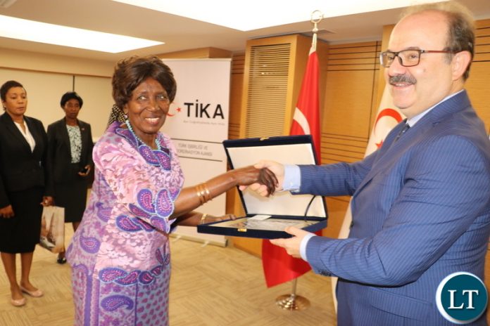 Vice-President Inonge Wina receives a gift from TIKA President, Dr Serdar Cam in Ankara today-Picture by JERRY MUNTHALI