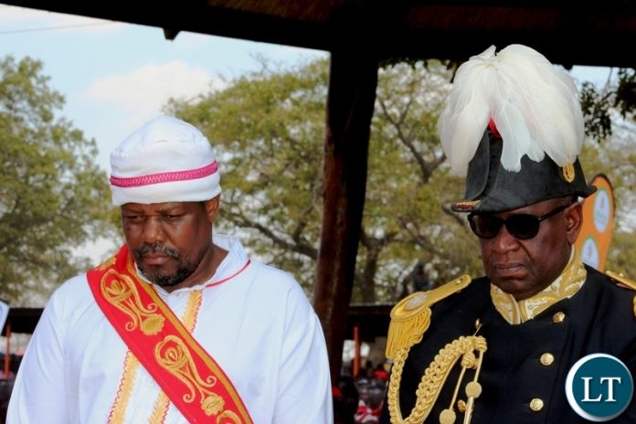 PARAMOUNT Chiefs Gawa Undi of the Chewa ( in white) and his guest, Litunga, Lubosi Imwiko the second, of the Lozi people in Western Province, at this year’s Kulamba traditional ceremony of the Chewa held at Mkaika in Katete on Saturday. PICTURE BY STEPHEN MUKOBEKO/ZANIS