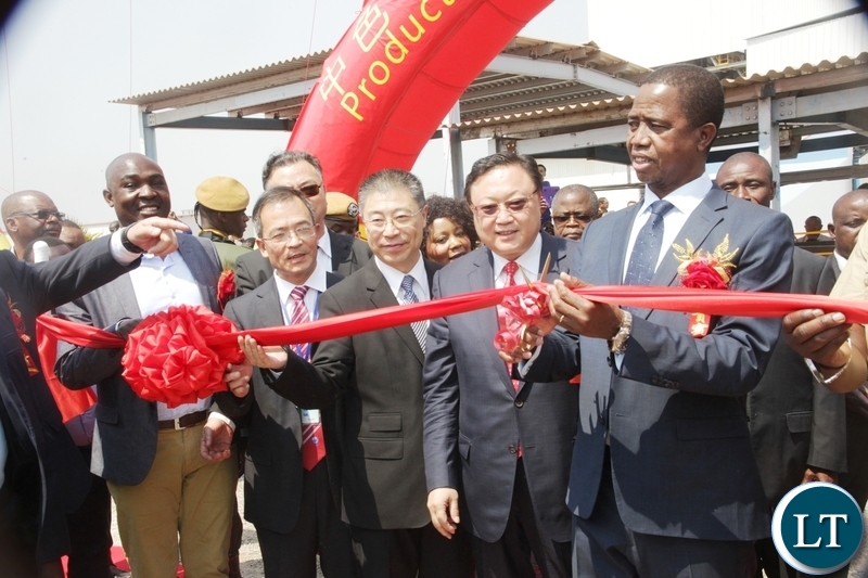 President Edgar Lungu cutting the ribbon to officially commission the NFCA mining project in Chambishi