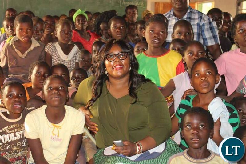 nformation and Broadcasting Services Minister who is also Chief Government Spokesperson & Petauke Member of Parliament Hon Dora Siliya MCC with kids at Chimunsi Primary School after the launch of the Satellite Village Television in Sinda District