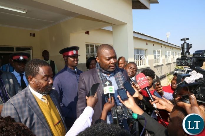 Lusaka Province Minister Bowman Lusambo (c)flanked by Kafue District Commissioner Joseph Kamana (L) talks to journalists during the spot check of some selected government departments in Kafue District Lusaka Province Minister Bowman Lusambo (c)flanked by Kafue District Commissioner Joseph Kamana (L) talks to journalists during the spot check of some selected government departments in Kafue District