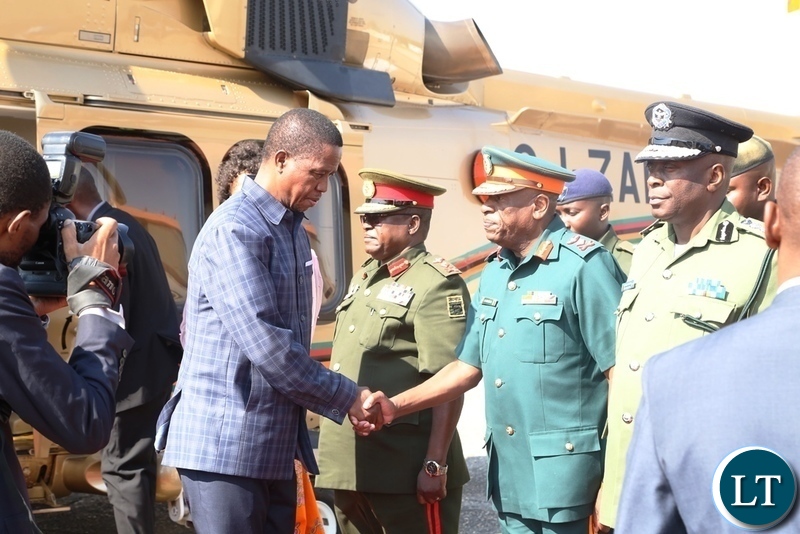 President Edgar Lungu greets ZNS commandant Lt.Gen.Nathan Mulenga whilst other Service Chiefs looks on shortly before his departure to Livingstone at Lusaka City Airport