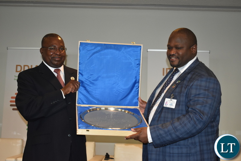 Minister of National Development Planning Alexander Chiteme receiving the medal from AU Commissioner for Trade and Industry Albert Muchanga on behalf of President Edgar Lungu on 26 September 2018. The United Nations Industrial Development Organisation (UNIDO), African Union, Food and Agriculture Organisation, UN Economic Commission for Africa and the African Development Bank have jointly conferred a medal of recognition on President Lungu as a champion of the Third Industrial Development Decade for Africa (IDDA3). PHOTO | CHIBAULA D. SILWAMBA | MNDP