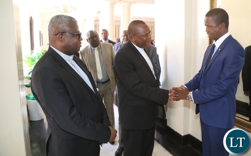 President Edgar Lungu shake hands with Vice Chair of the Conference of Catholic Bishops of Democratic Republic of Congo Bishop Fridolin Ambongo whilst Secretary General of the Conference of Catholic Bishops of Democratic Republic of Congo Bishop Donatien Nshole shortly meeting the President at State House