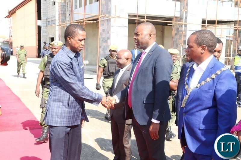 President Edgar Lungu greets Lusaka Province Minister Bowman Lusambo who is flanked by Lusaka mayor Miles Sampa shortly before his departure to Livingstone at Lusaka City Airport
