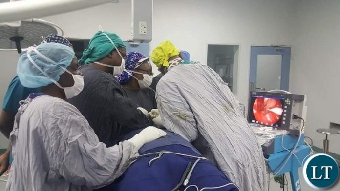 UTH team of Neurosurgeons and ENT surgeons in the operating theatre