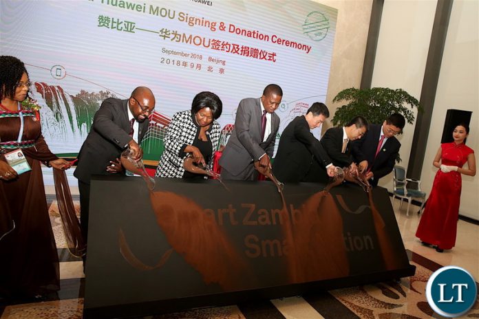 President Edgar Chagwa Lungu, Finance Minister Margaret Mwanakatwe, Communications and Transport Minister Brian Mushimba and Huawei Senior vice-president Li Da Feng