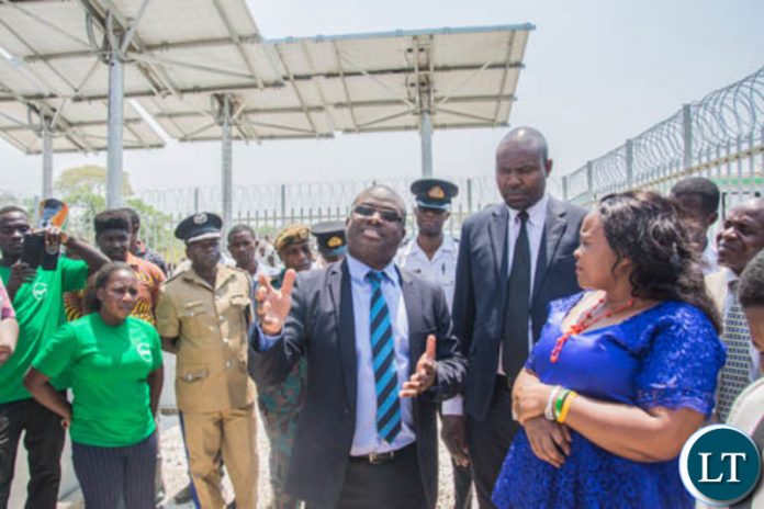 Zamtel CEO Sydney Mupeta explains the technical specifications of the new tower to Ngabwe Council Chairperson Tshili Mizinga during the commissioning of the tower in Ngabwe on Wednesday