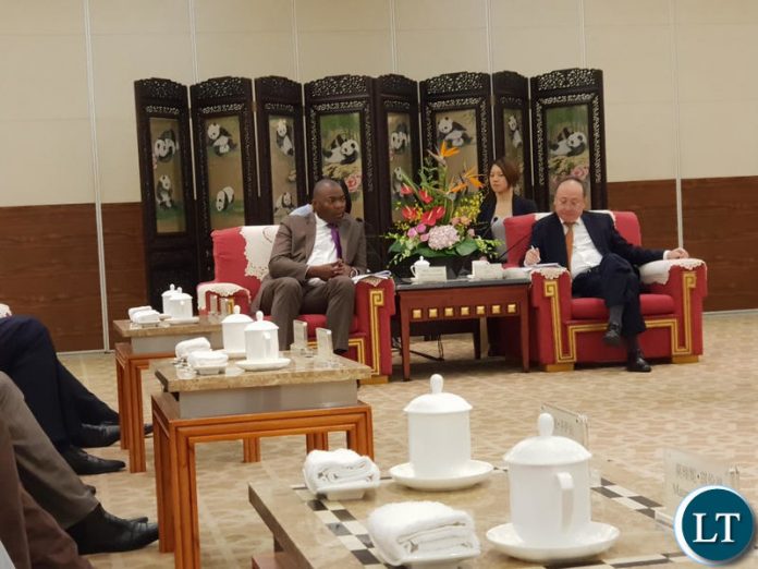 Lusaka Province Minister Bowman Lusambo confers with the Governor of Sichuan Province of China Mr. Yin Li at the 3rd Western China Public Procurement Conference during the 17th Western China International Fair being held in Chengdu, Sichuan Province China.