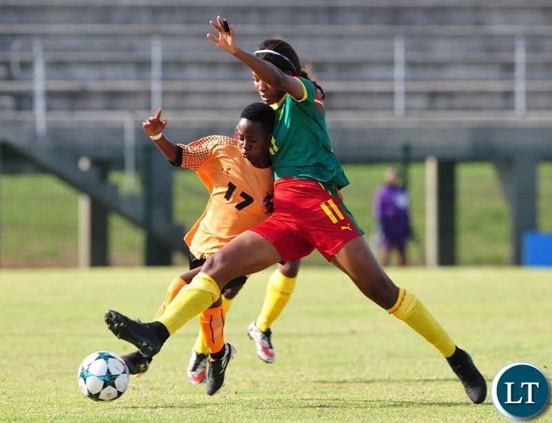 Mary Mwakapila of Zambia is tackled by Raissa Mbappe Etoundi of Cameroon during the 2018 Cosafa Womens Championship game between Zambia and Cameroon at Wolfson Stadium in Port Elizabeth on 15 September 2018 © Ryan Wilkisky/BackpagePix