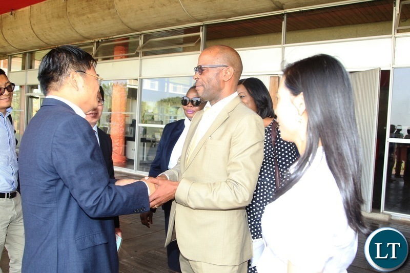 Chinese Counselor to Zambia,Lai Bo is welcomed by Deputy Secretary to cabinet,Christopher Mvunga during the 2019 national budget in Lusaka.