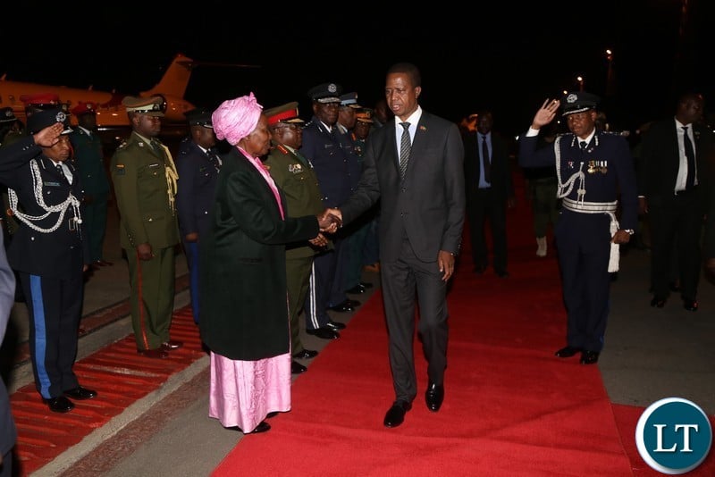 President Edgar Lungu being welcomed by Vice President Inonge Wina on arrival from China at Kenneth Kaunda International Airport