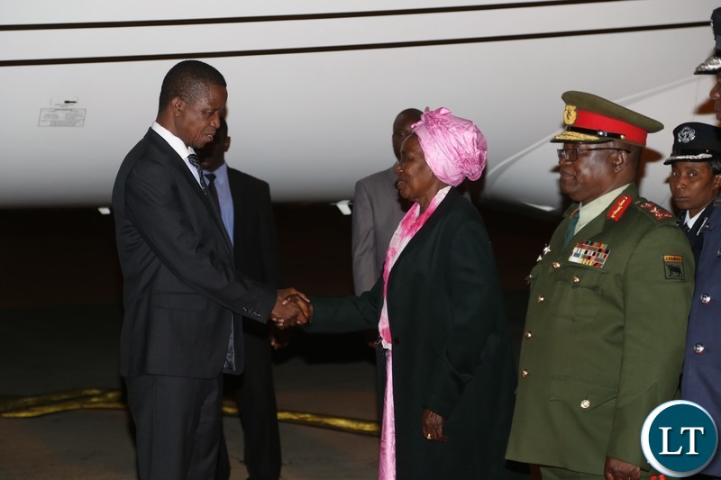 President Edgar Lungu being welcomed by Vice President Inonge Wina on arrival from China at Kenneth Kaunda International Airport