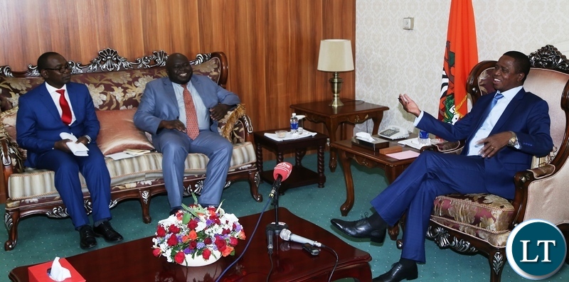 President Edgar Lungu speaking to with Economics Association of Zambia president Dr. Lubinda Habazooka and Vice President Dr. Austin Mwange during the meeting at State House